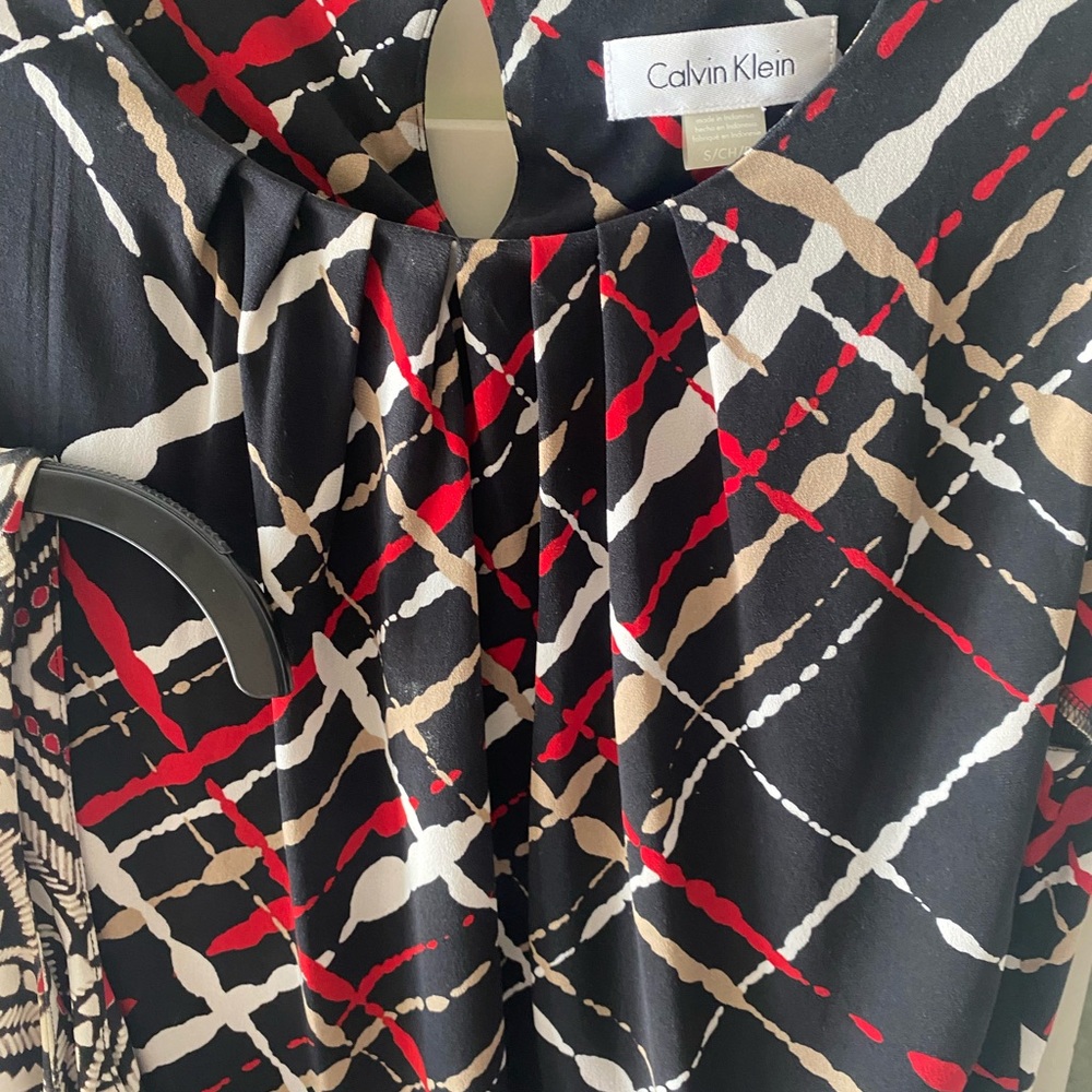 Two Calvin Klein Black, Red, and Cream Geometric Work Tops